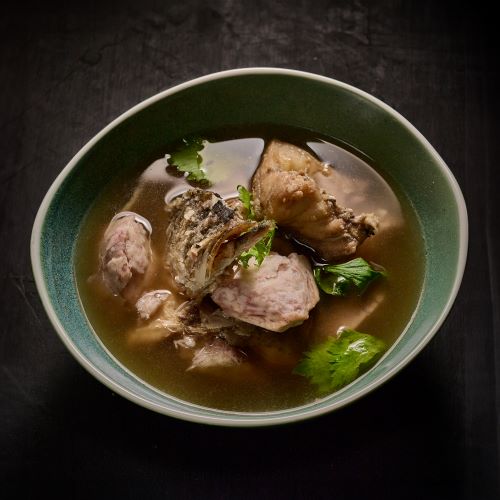 Taro soup with fish head.