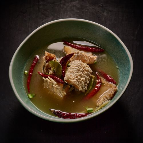 Herbal sour clear soup with sea bass belly