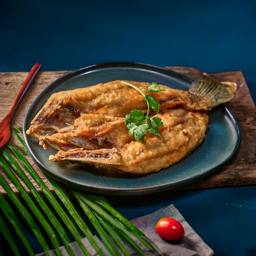 Deep fried white snapper in fish sauce.