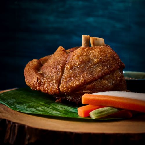 Deep fried pork knuckle served with spicy dipping sauce.