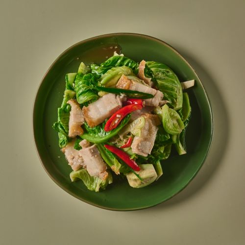 Stir fried baby cabbage with crispy pork.