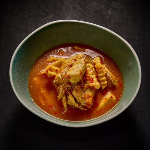 Sour curry with fish and coconut shoots.